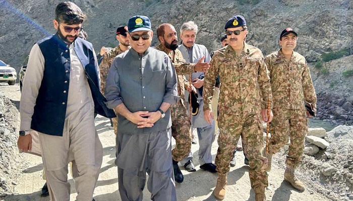 Federal Minister for Communications, Privatisation & Investment Board Abdul Aleem Khan (2nd left) inspects the damage caused by landslides on the main highway connecting to Gilgit and Skardu on May 6, 2024.  Facebook/Abdul Aleem Khan
