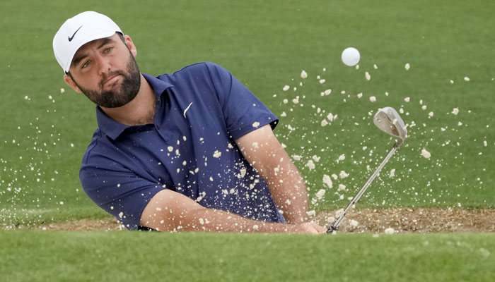 Golfer Scottie Scheffler takes a shot during a practice round for the Masters Tournament golf tournament at Augusta National Golf Club on April 9, 2024. — USA Today