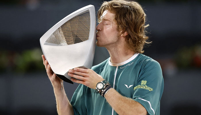 Russias Andrey Rublev celebrates with the trophy after winning his final match against Canadas Felix Auger Aliassime on May 5, 2024.— Reuters