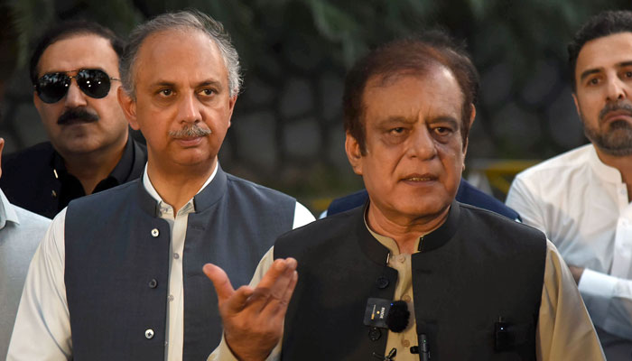 PTIs Leader of Opposition in Senate Syed Shibli Faraz (right) pictured alongside partys Secretary General and Opposition Leader in the NA Omar Ayub talk to media persons at Khyber Pakhtunkhwa House in the Federal Capital on May 6, 2024. — Online