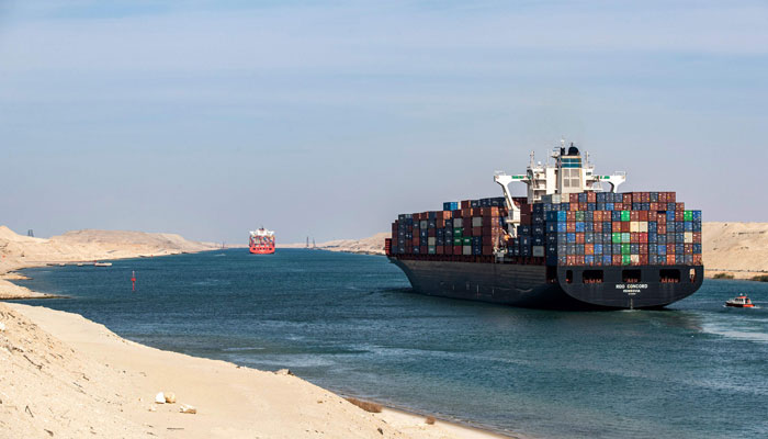 This picture shows the Liberia-flagged container ship RDO Concord sailing through Egypts Suez Canal in the canals central hub city of Ismailia on the 150th anniversary of the canals inauguration. — AFP/File