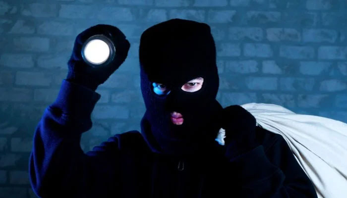 A representational image of a burglar. — X/@merriamwebstar/File