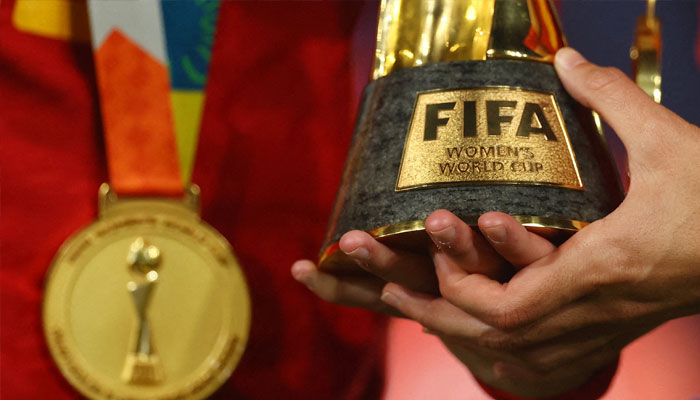 General view of a Spain player holding the World Cup trophy after the match. — Reuters/File
