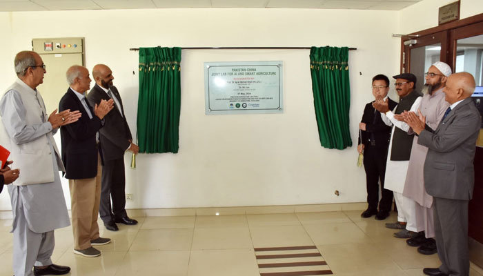 Participants clap after the inauguration of the Pakistan China Joint Lab for Artificial Intelligence and Smart Agriculture (AI&SA) on May 8, 2024. — Facebook/University of Agriculture Faisalabad - Official