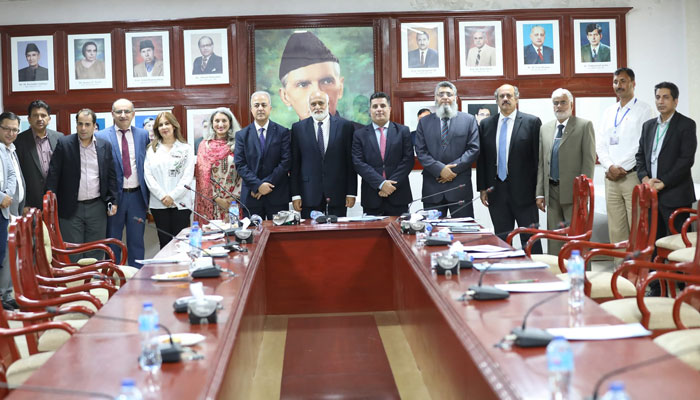 A delegation led by Dr. Rami Waheed Al-Dhulli, the Deputy Minister of Education and Educational Affairs of the Syrian Arab Republic poses for a group photo during visits to Quaid-i-Azam University (QAU) on May 8, 2024. — Facebook/Quaid-i-Azam University,Islamabad