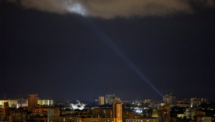 Ukrainian servicemen use a searchlight as they search for drones in the sky over the city during a Russian drone and missile strike in Kyiv, Ukraine May 8, 2024. — Reuters