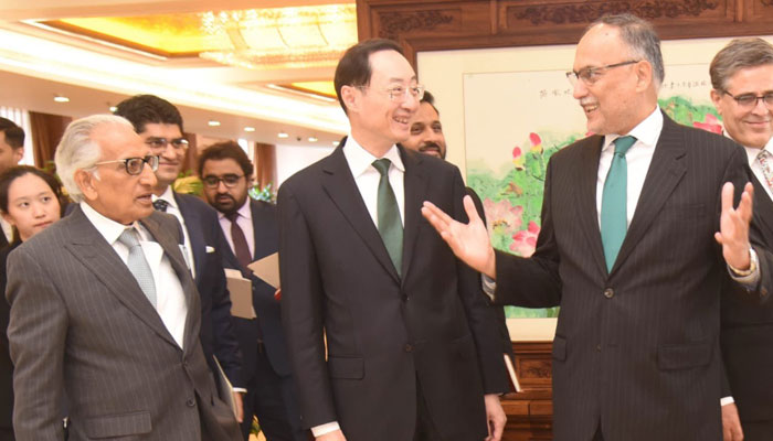 PMs Special Assistant on Foreign Affairs Tariq Fatemi (left) lookks on as Federal Planning Minister Ahsan Iqbal (right) interacts with Chinas Vice Foreign Minister Sun Weidong (centre) in Beijing China in this image released on May 8, 2024. — X/@betterpakistan