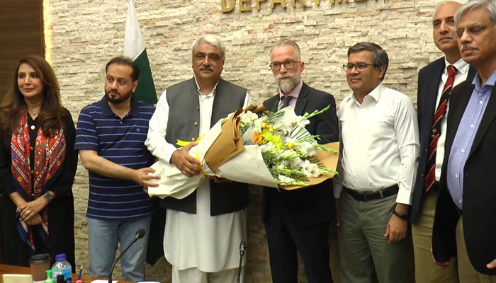 In this still, Provincial Health Ministers Khawaja Salman Rafique and Khawaja Imran Nazir present flower bouquets to a delegation of the United Nations Office for Project Services on May 9, 2024. — Facebook/Khawaja Salman Rafique