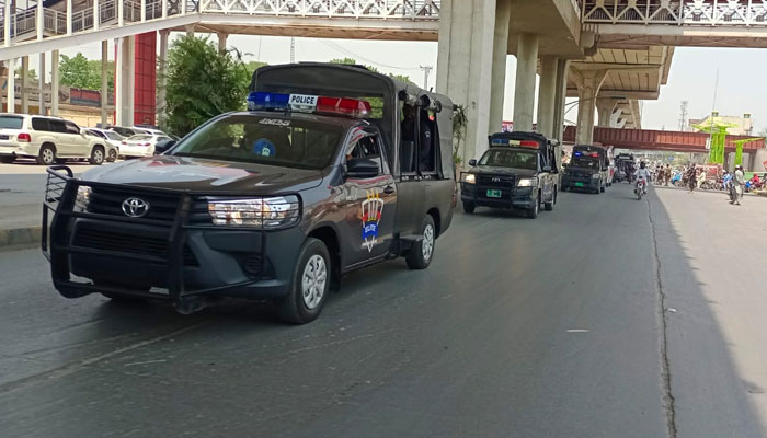 Police vehicles can be seen on the road of Rawalpindi during the flag march regarding law and order and maintain peace on May 9, 2024. — Facebook/Rawalpindi Police