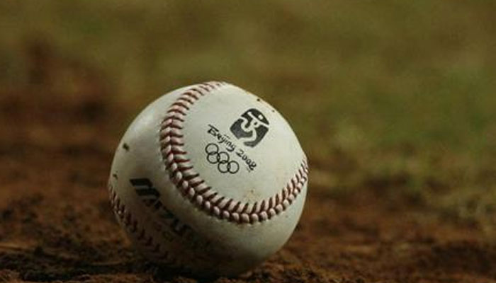 A baseball with the Olympic logo lies on the field during the US-China baseball game at the Beijing 2008 Olympic Games August 18, 2008. — Reuters