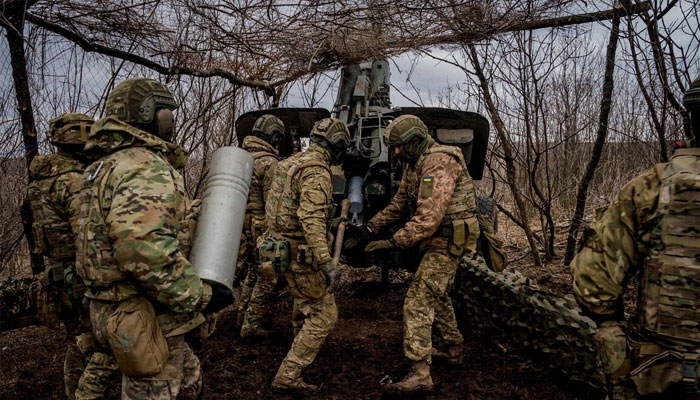 Ukrainian servicemen load a shell into a howitzer near Bakhmut, Ukraine. — AFP/File