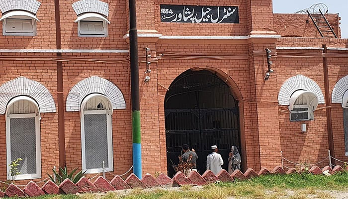 Visitors stand at main gate of the central jail in Peshawar in this undated photo. — Facebook/Central Prison Peshawar