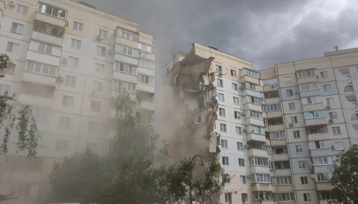 A view of a partially collapsed apartment building which was damaged by a Ukrainian strike in Belgorod on May 12, 2024. — AFP