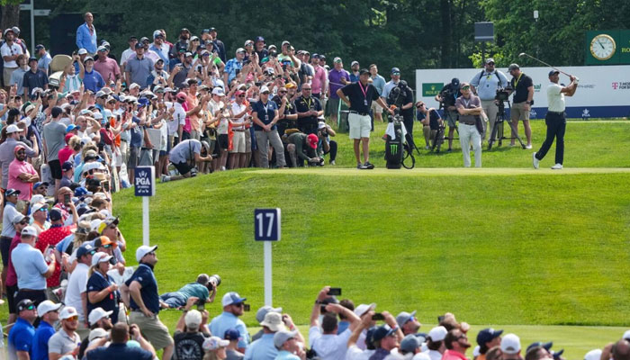 Tiger Woods drives off on the 17th tee as spectators watch during a practice round for the PGA Championship at Valhalla Golf Club. — Reuters/File