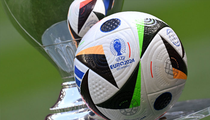General view of the Fussballliebe match ball on display next to the European Championship trophy during the presentation.— Reuters/file