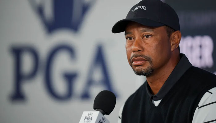 Tiger Woods talks with members of the media in a press conference during a practice round for the PGA Championship golf tournament at Valhalla Golf Club. — USA Today/File