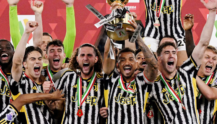 Juventus Danilo celebrates with the trophy and teammates after winning the Coppa Italia final. — Reuters/file