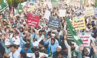 Despite arrests, raids, JI and farmer leaders hold protest in Lahore