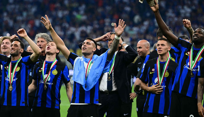 Inter Milans forward Lautaro Martinez (C) celebrates with teammates during the trophy ceremony for the Italian Champions following the Italian Serie A football match between Inter Milan and Lazio in Milan, on May 19, 2024. — AFP