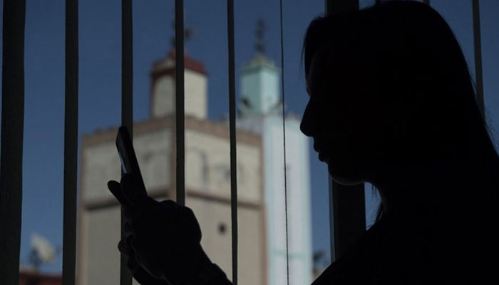 This representational image shows a person using a mobile phone. — AFP/File