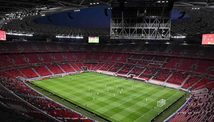 Spectators watch the Hungarian cup final between FC MOL Fehervar and FC Ujpest in the Puskas Arena of Budapest on May 3, 2024. — AFP