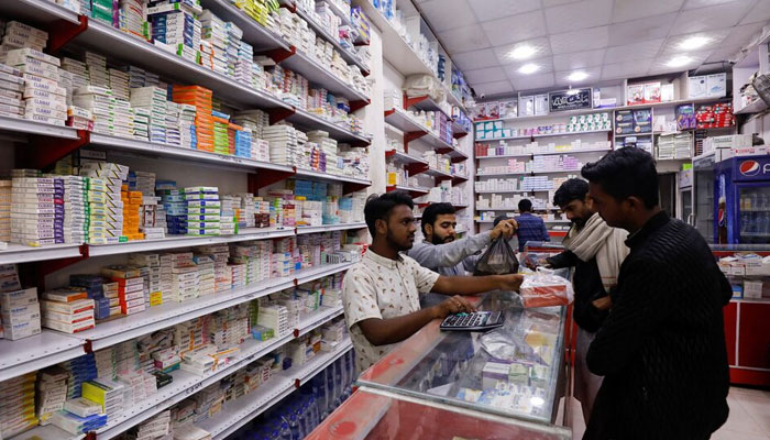 A representational image showing customers buying medicines at a pharmacy. — Reuters/File