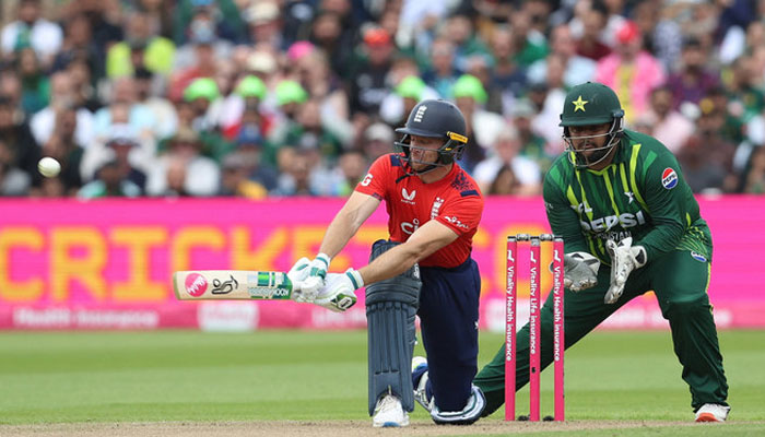 England’s Jos Buttler plays shot as Pakistan’s Azam Khan (right) watches ball during second T20 International between England and Pakistan at the Edgbaston Cricket Ground in Birmingham on May 25, 2024. — Reuters