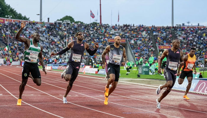 South African Akani Simbine (right) seen running in this undated image.— AFP/file