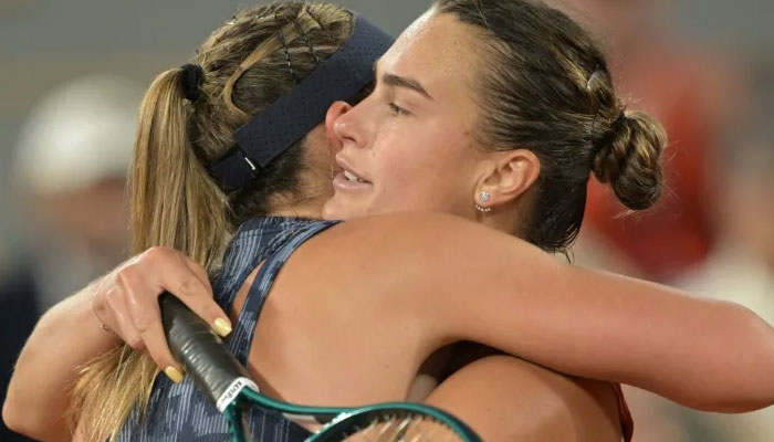 Belarus Aryna Sabalenka (R) embraces Spains Paula Badosa after winning at the end of their womens singles match on Court Philippe-Chatrier on day seven of the French Open tennis tournament at the Roland Garros Complex in Paris on June 1, 2024. — AFP