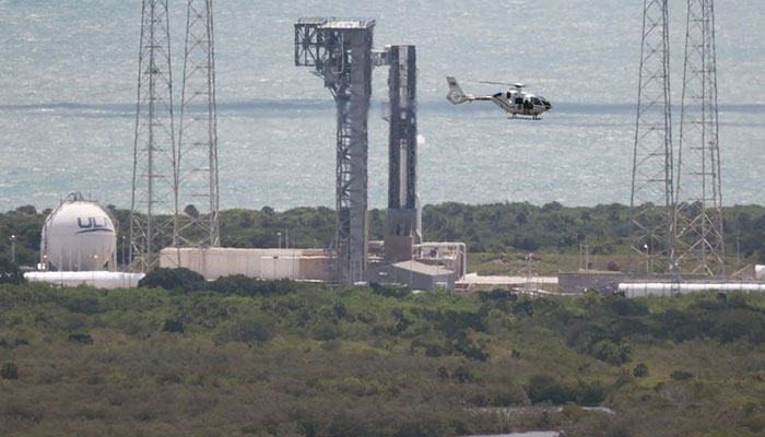 A security helicopter flies past Boeing’s Starliner spacecraft before its flight was scrubbed as it sits atop a United Launch Alliance Atlas V rocket at Space Launch Complex 41 on June 01, 2024, in Cape Canaveral, Florida. — AFP