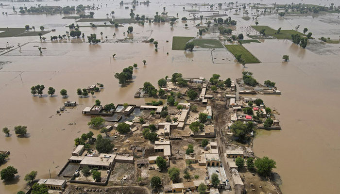 An aerial view of a village wrecked by floods in Punjabs Okara district on August 28, 2023. — AFP