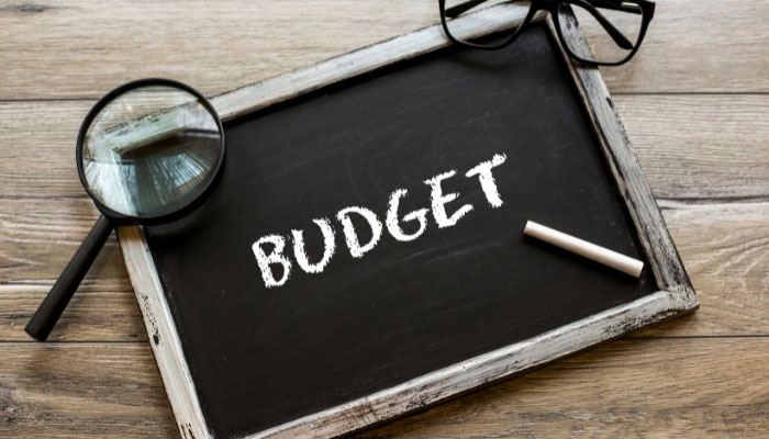A representational image of budget written with chalk on a miniature black board. — Canva/File