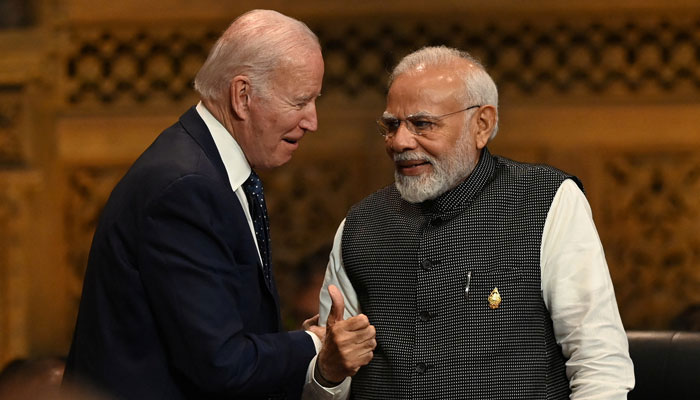 US President Joe Biden (left) and Indian PM Narendra Modi interact ahead of G20 summit in India. — AFP/File
