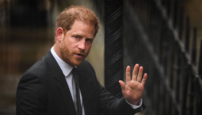 File: Britains Prince Harry, Duke of Sussex waves as he arrives at the Royal Courts of Justice, Britains High Court, in central London on March 28, 2023. — AFP