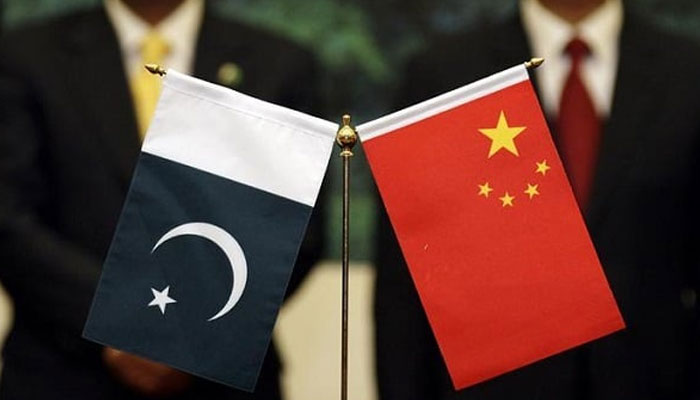 A representational image of Pakistani and Chinese flags placed together at an event. — Reuters/File