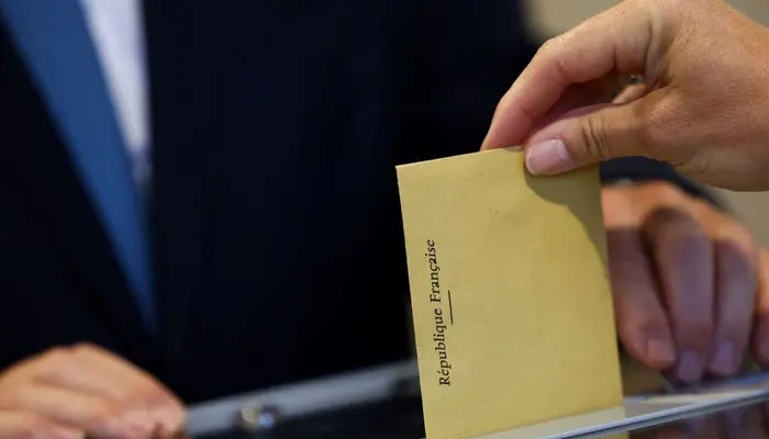 A person votes during the European Parliament election, in Le Touquet-Paris-Plage, France, June 9, 2024. — Reuters