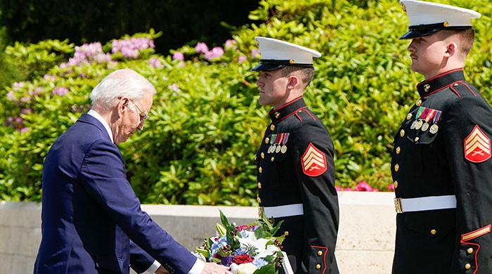 Biden visits WWI cemetery in France in rebuke to Trump