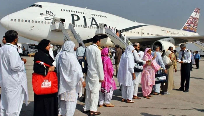 Passengers are standing in queue to board a PIA plane. — APP/File