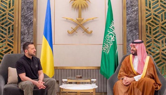 A handout picture provided by the Saudi Press Agency (SPA) on June 12, 2024, shows Ukraine s President Volodymyr Zelensky (L) meeting with Saudi Arabia s Crown Prince Mohammed Bin Salman in Jeddah. —AFP