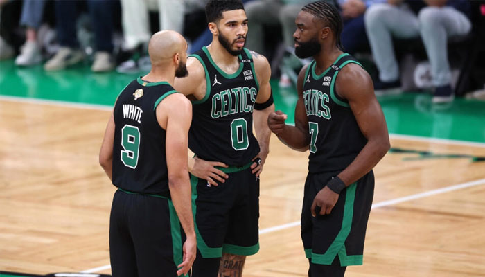 Bostons Derrick White, Jayson Tatum and Jaylen Brown talk things over during the Celtics victory over Dallas in game two of the NBA Finals. — AFP