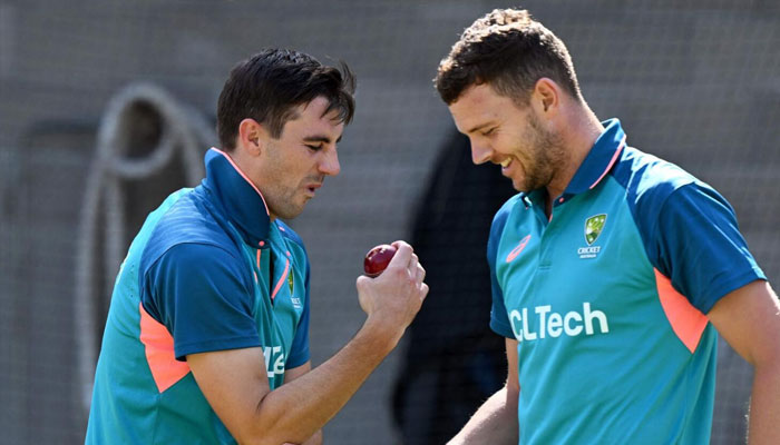 Australias Pat Cummins (left) and Josh Hazlewood (right). — AFP/file