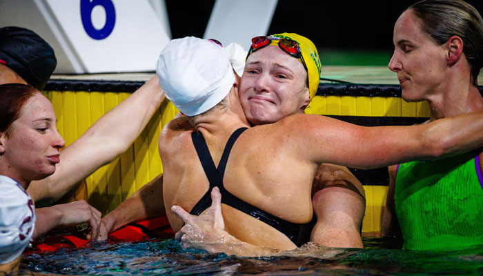 An emotional Cate Campbell is embraced by fellow competitors after the womens 50m freestyle final in Brisbane. — AFP File