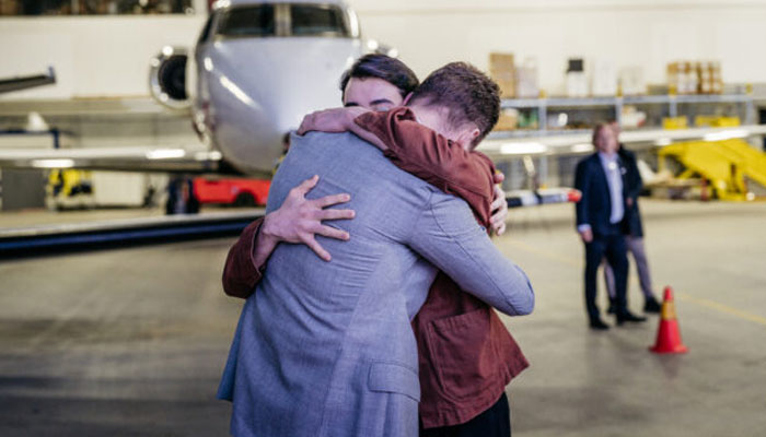 Swedish citizen Johan Floderus is greeted by his relatives upon his arrival at Arlanda airport near Stockholm, on June 15, 2024. — AFP