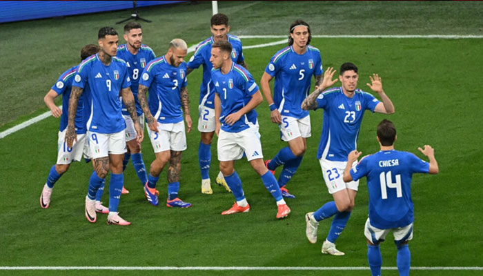 Italys defender #23 Alessandro Bastoni celebrates with teammates after scoring his teams first goal during the UEFA Euro 2024 Group B football match between Italy and Albania at the BVB Stadion in Dortmund on June 15, 2024. — AFP