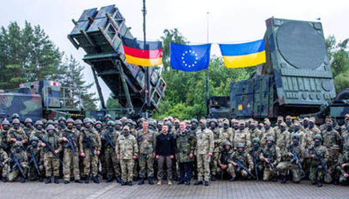 Ukrainian President Volodymyr Zelenskiy poses with soldiers during his visit to a military training area to find out about the training of Ukrainian soldiers on the Patriot anti-aircraft missile system, at an undisclosed location, in Germany, June 11, 2024. — Reuters
