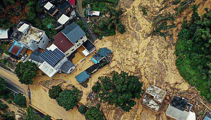This photo shows an aerial view of a car driving past a landslide site after storms in Longyan, in eastern China’s Fujian province on June 17, 2024. — AFP