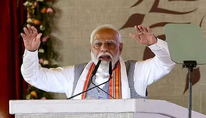 Indias Prime Minister Narendra Modi gestures during the Kisan Samman Sammelan (farmers honour conference) on the outskirts of Varanasi on June 18, 2024. — AFP