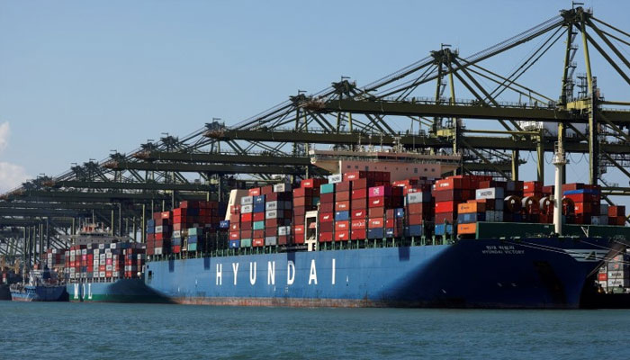 Container ships are berthed at PSAs Pasir Panjang Terminal in Singapore  on July 15, 2019. — Reuters