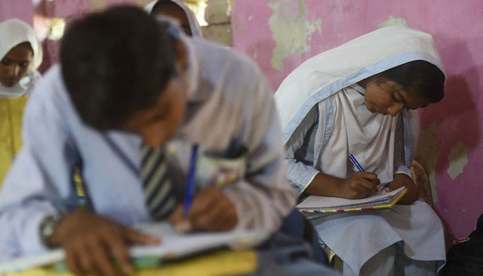 A representational image of students attending a class at a government school. — AFP/File