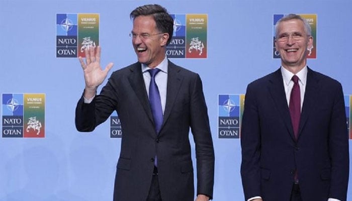 NATO Secretary General Jens Stoltenberg (R) welcomes the Netherlands s Prime Minister Mark Rutte for the NATO Summit in Vilnius, Lithuania, on July 11, 2023. — AFP